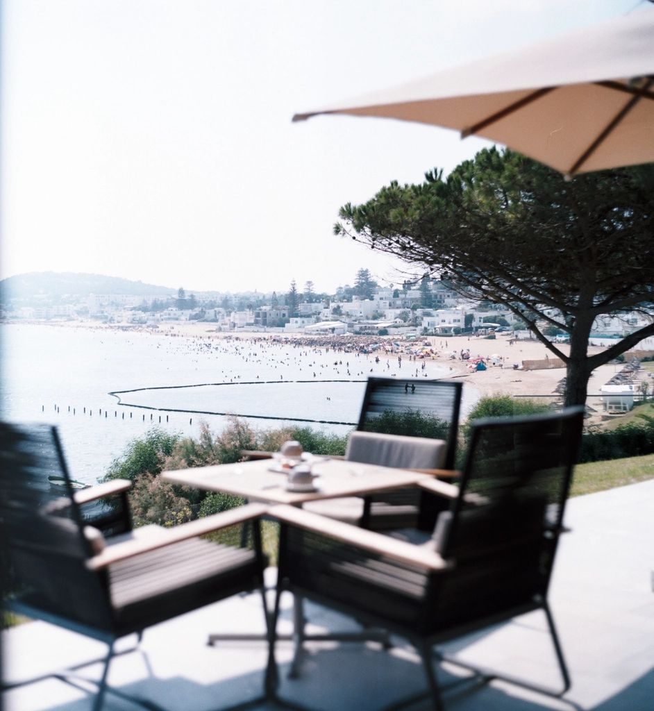 A private terrace with outdoor seating and a view